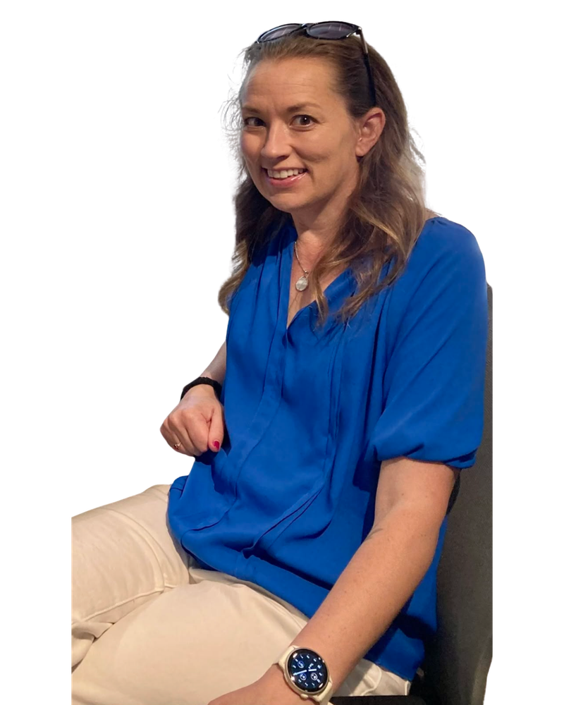 Sarah Rogerson, seated, wearing a blue blouse